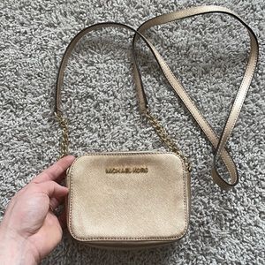 Gold Michael Kors mini crossbody